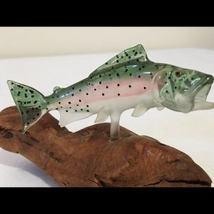 Bass made of glass on driftwood